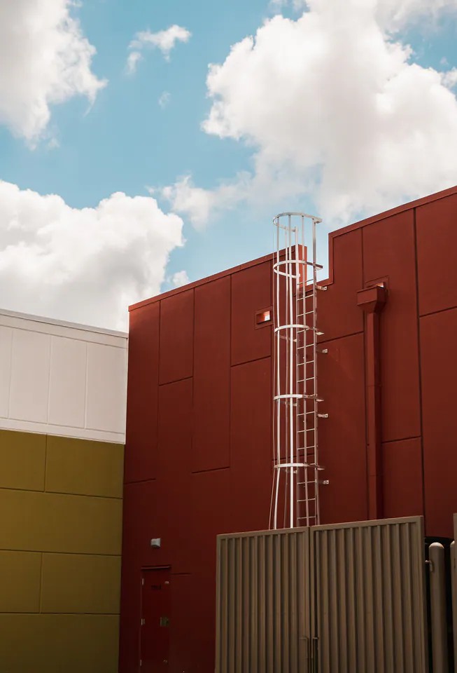 Colorful commercial building exterior photographed beneath a blue sky